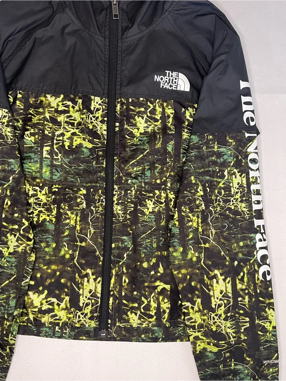 The North Face Kids Black Hooded Rain Jacket with Neon Green Print